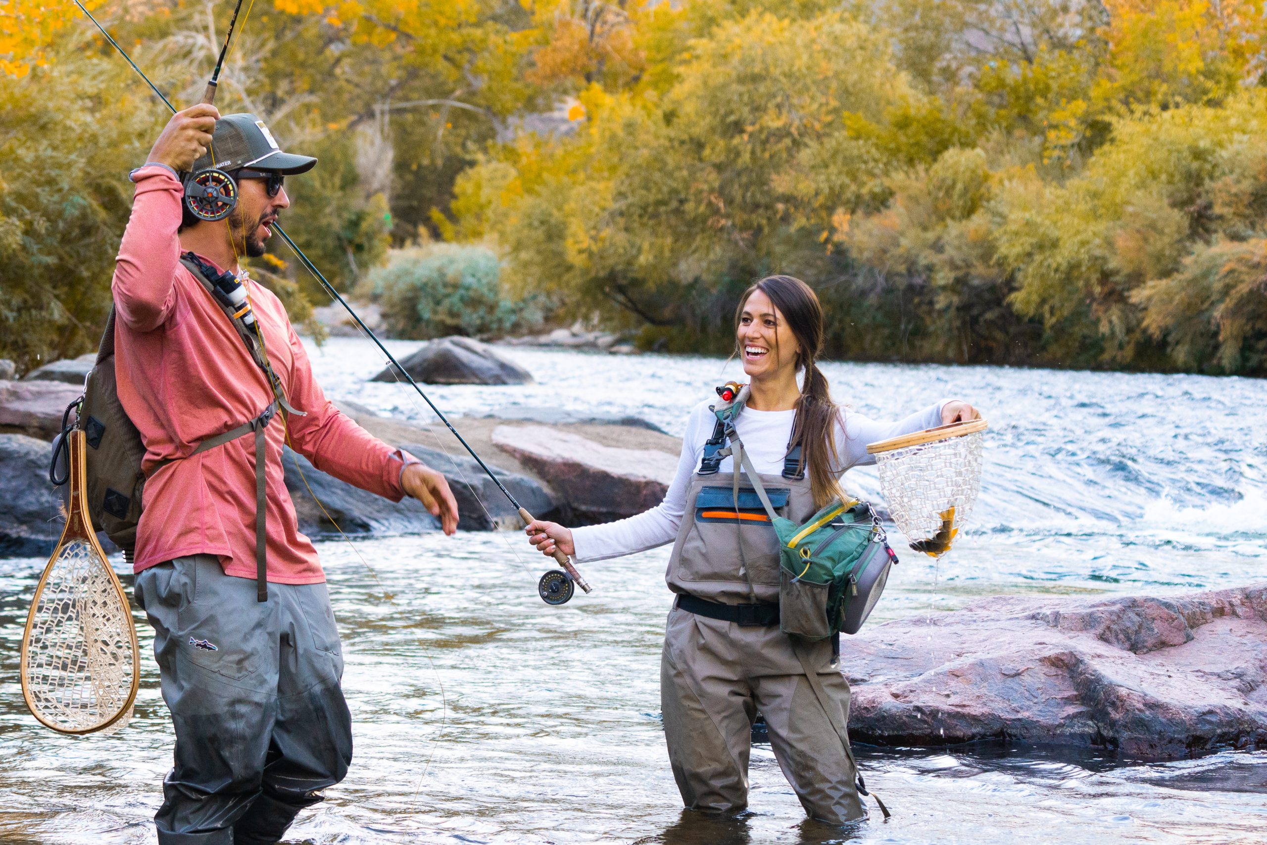 Two people fly fishing on Clear Creek in the fall