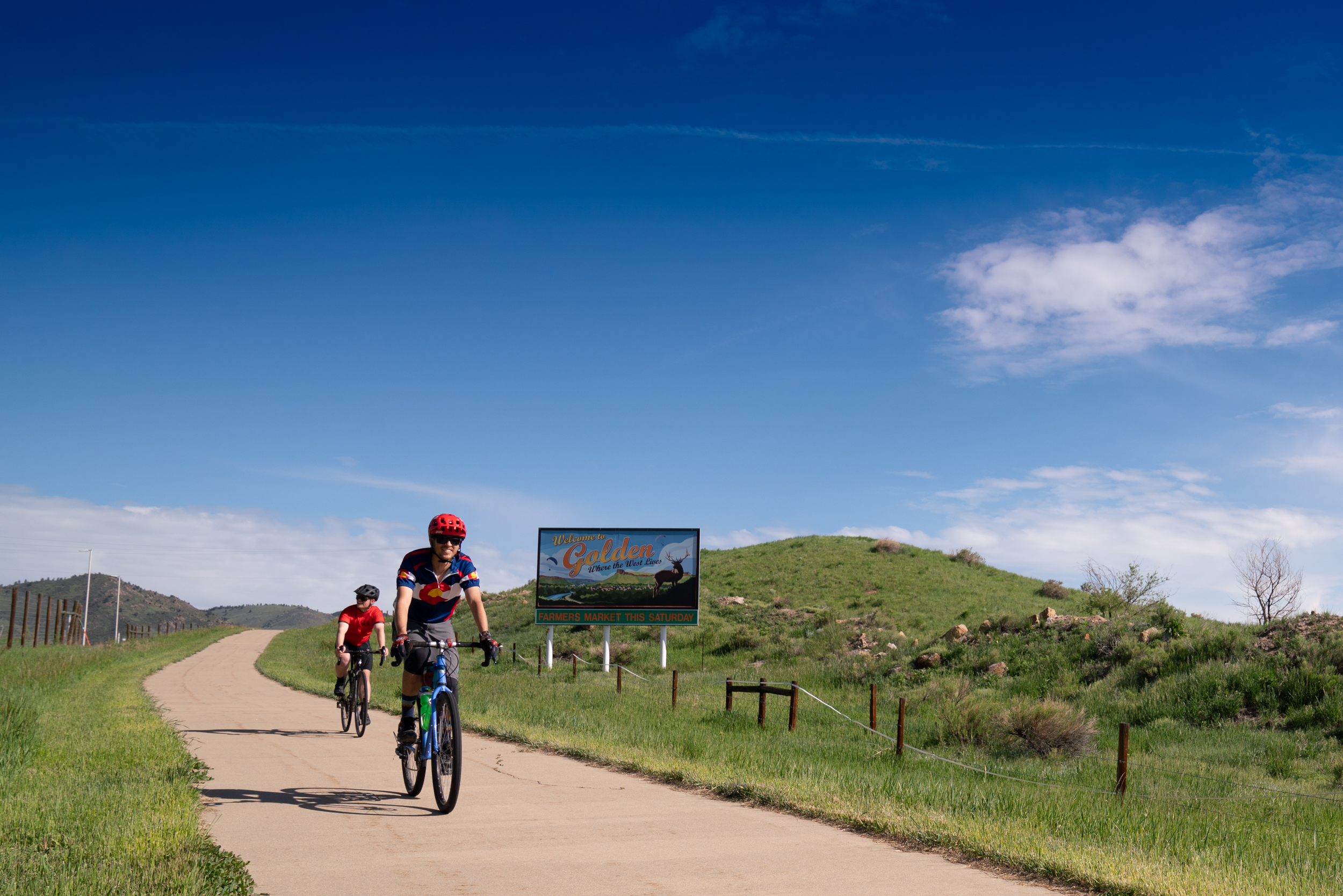 Biking by Triceratops Trail on 6th Ave Paved Trail