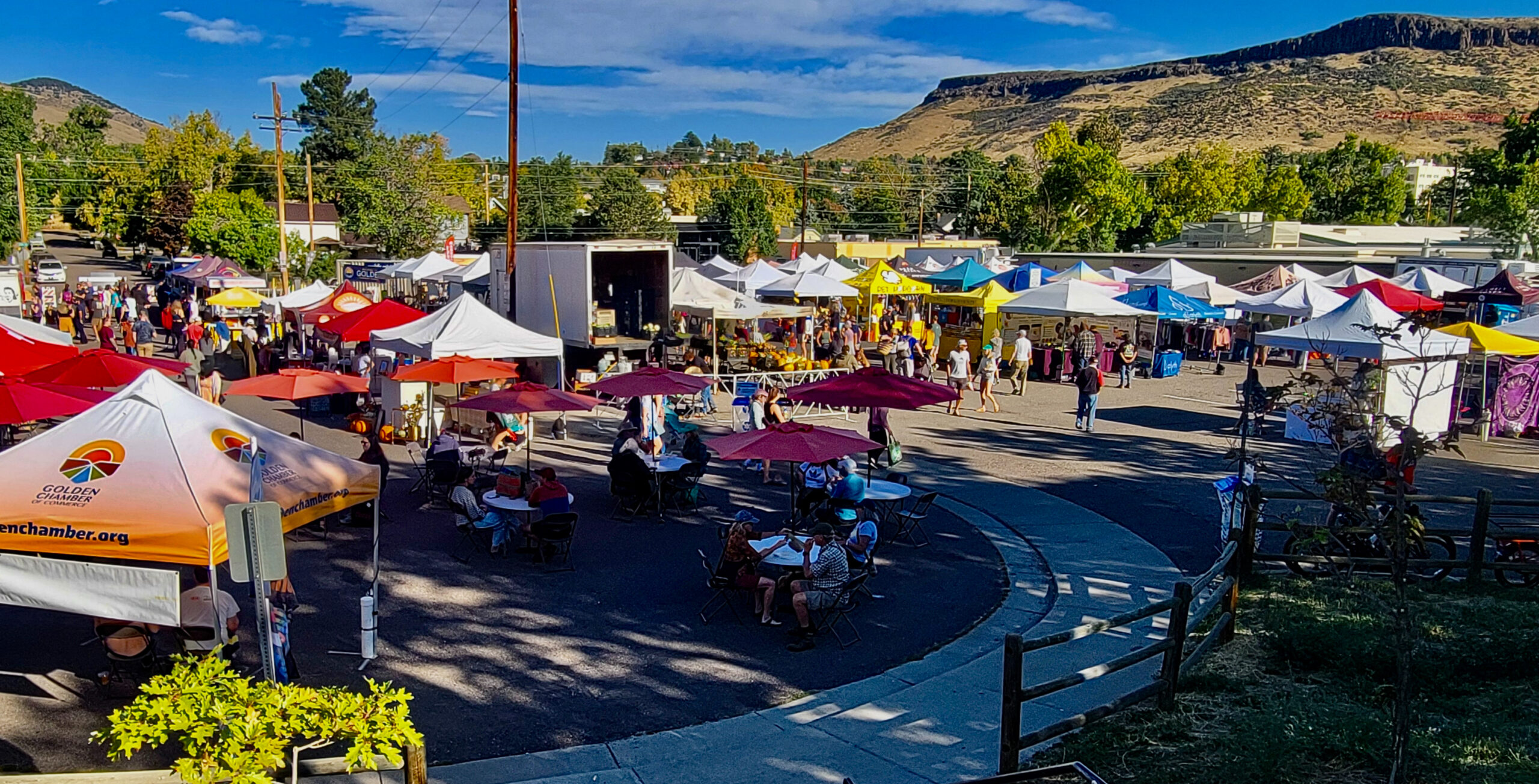 Golden Farmers Market overview of the vendors and people milling about with North Table Mountain in the background