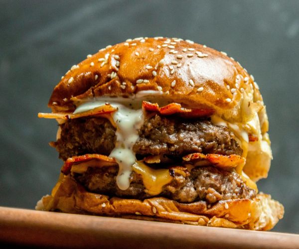 A photo of a juicy, double patty cheese burger.
